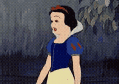 Snow White From Disney 'S Snow White And The Seven Dwarfs Is Standing In A Dark Forest . GIF