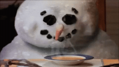 Snowman Sitting At Table With Soup GIF