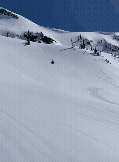 Snowmobile Going Down Snowy Hill GIF