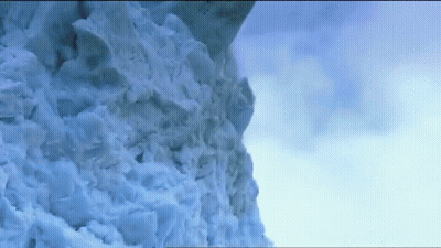 Snowy Mountain Against Blue Sky GIF