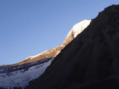 Snowy Mountain Under Blue Sky GIF