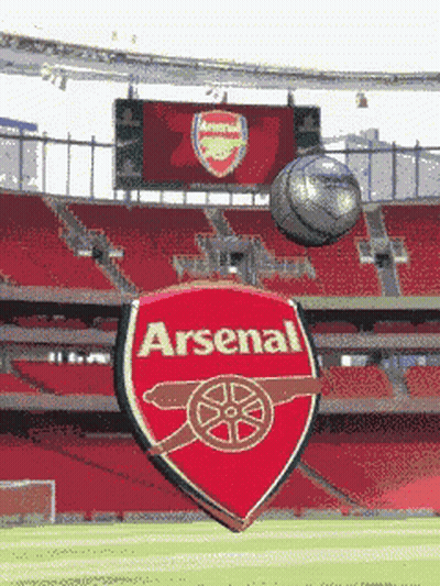 Soccer Ball Flying In Front Of Arsenal Logo GIF