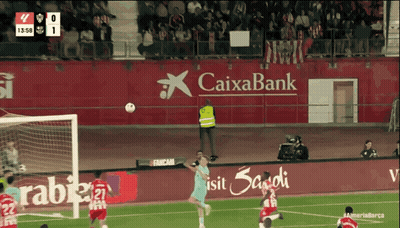 Soccer Game In Front Of Caixabank Banner GIF