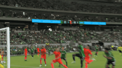 Soccer Game In Front Of Crowd With Coca Cola Scoreboard GIF