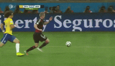 Soccer Game In Front Of Entauro.com Sign GIF