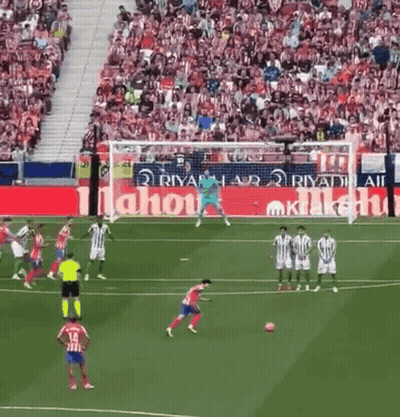 Soccer Game In Front Of Large Mahou Ad GIF