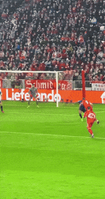 Soccer Game In Front Of Lieferando Banner GIF
