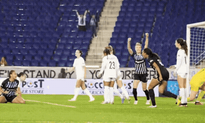 Soccer Game In Front Of Post Sign GIF