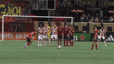 Soccer Game In Front Of Terminus Legion Sign GIF