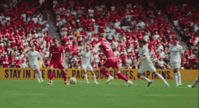 Soccer Game In Front Of Yellow Stay In The Game Sign GIF