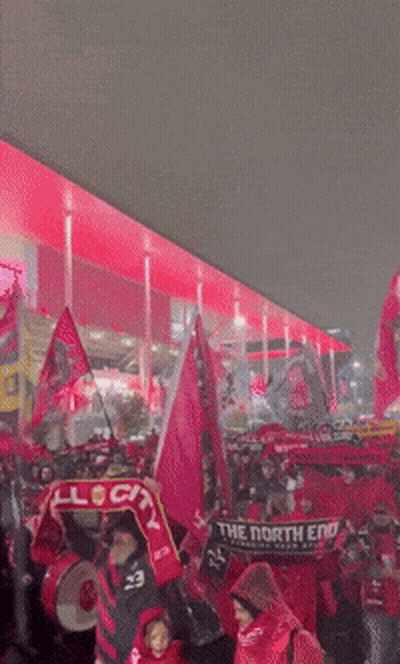 Soccer Game in Stadium With Coca Cola and Adidas Ads