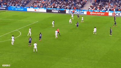 Soccer Game On Field With Puma And Boulangerie Ads GIF