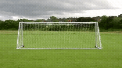 Soccer Goal In Field With Cloudy Sky GIF