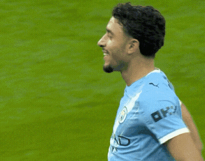 Soccer Player Blue Shirt With OK On Sleeve GIF