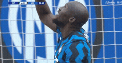 Soccer Player Catching Ball In Blue Black Jersey GIF