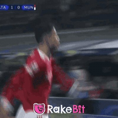 Soccer Player Celebrates Goal With Rakebit Logo GIF