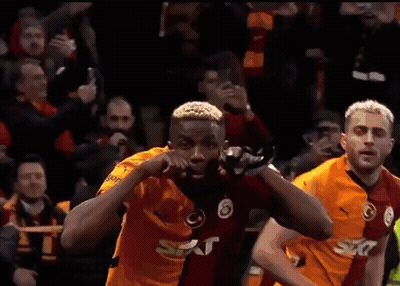 Soccer Player Celebrating Goal In Front Of Fans GIF
