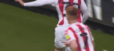 Soccer Player Celebrating Goal In Red And White Striped Jersey GIF