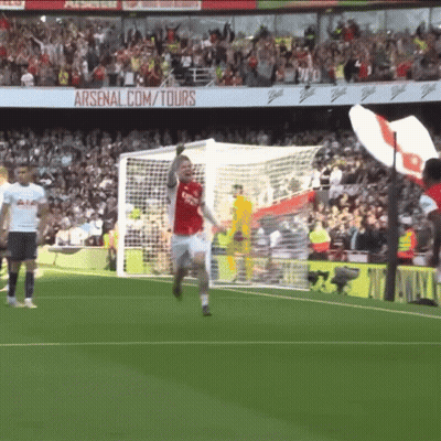 Soccer Player Celebrating Goal With Arsenal.com Tours Background GIF