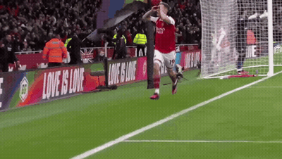 Soccer Player Celebrating Goal With Love Is Love Banner GIF