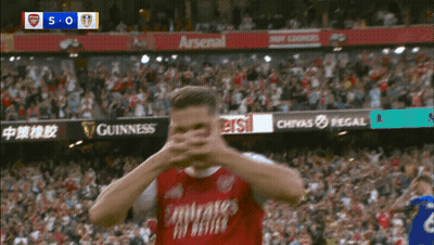 Soccer Player Covering Face In Red Jersey GIF
