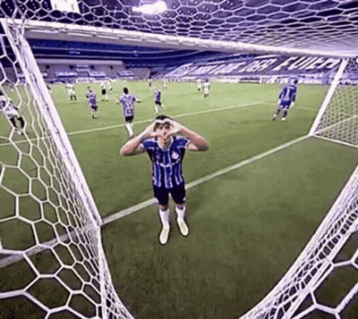 Soccer Player Hands Over Eyes In Front Of Goal GIF