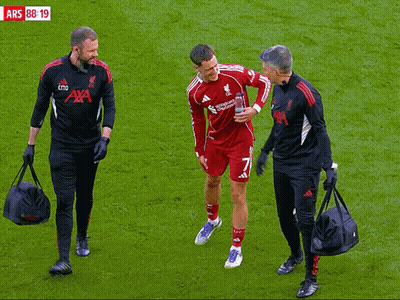 Soccer Player Helped Off Field By Men In Aya Shirts GIF