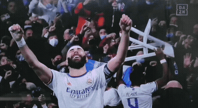 Soccer Player Holding Chair Over Head In Emirates Shirt GIF