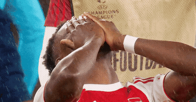 Soccer Player Holding Head In Champions League Jersey GIF