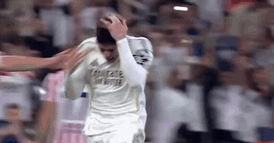 Soccer Player Holding Head In Pain GIF