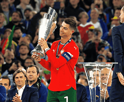 Soccer Player Holding Trophy Number 1 GIF