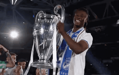 Soccer Player Holding Trophy With Blue Scarf GIF
