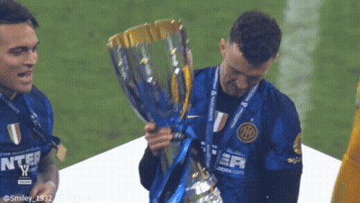 Soccer Player Holding Trophy With IO On Shirt GIF