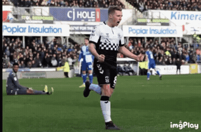 Soccer Player In Black And White Checkered Jersey Celebrating GIF