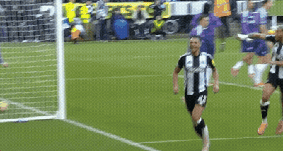 Soccer Player In Black And White Jersey Number 18 Celebrating Goal GIF