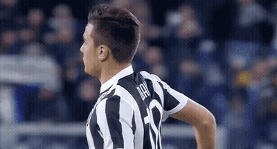 Soccer Player In Black And White Striped Jersey Standing On Field GIF
