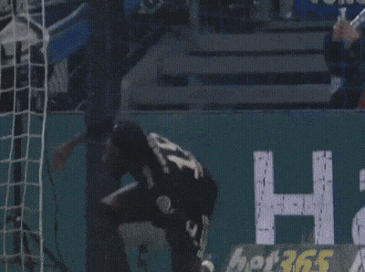 Soccer Player In Black Jersey With Letter T GIF