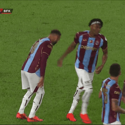 Soccer Player In Blue And Maroon Jersey Running GIF
