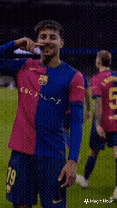 Soccer Player In Blue And Pink Jersey Number 9 GIF