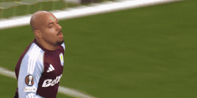 Soccer Player In Blue And White Jersey Celebrating Goal With Teammates GIF