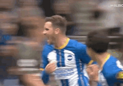 Soccer Player In Blue And White Jersey Celebrating Goal With Teammates GIF