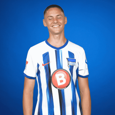 Soccer Player In Blue And White Striped Shirt With B GIF