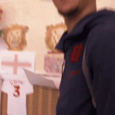 Soccer Player In Blue And Yellow Jersey Smiling GIF