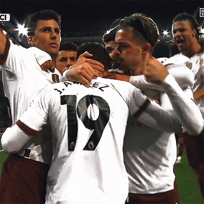 Soccer Player In Blue Etihad Airways Jersey Smiling And Pointing GIF