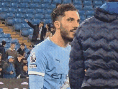Soccer Player In Blue Etihad Jersey Talking To Fan GIF