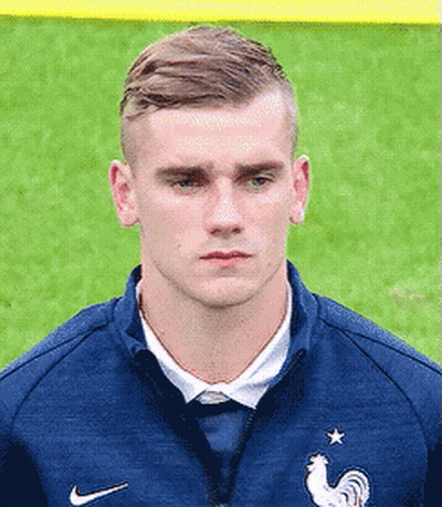 Soccer Player in Blue Jacket With Rooster