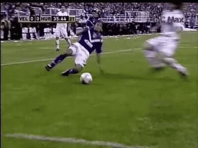 Soccer Player In Blue Jersey Kicking Ball GIF