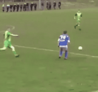 Soccer Player In Blue Jersey Kicking Ball GIF