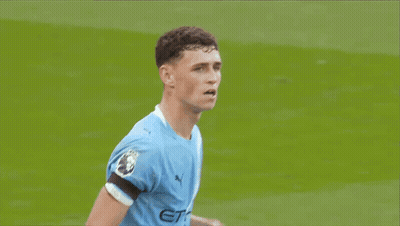 Soccer Player In Blue Jersey Standing On Field GIF