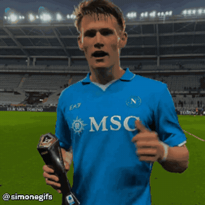 Soccer Player In Blue Msc Shirt Holding Trophy GIF